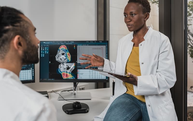 Doctor consulting patient via telemedicine